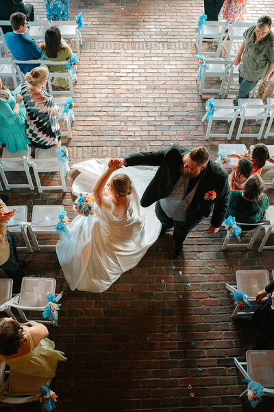 View looking down at a newlywed couple dancing 