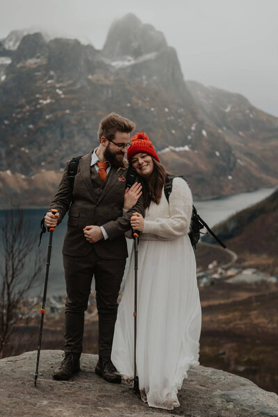 Elopement couple hiking the mountain in Senja, Norway