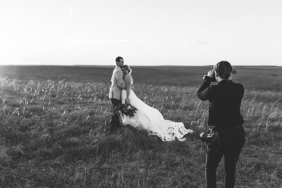Photographer photographing bride