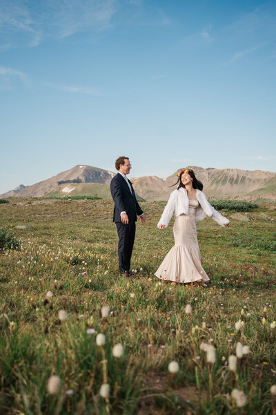 A bride laughs in the rain at her elopement ceremony in Buena Vista