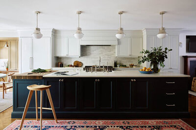 A custom kitchen design in a renovated Boston brownstone, blending historic charm with modern functionality and timeless details.