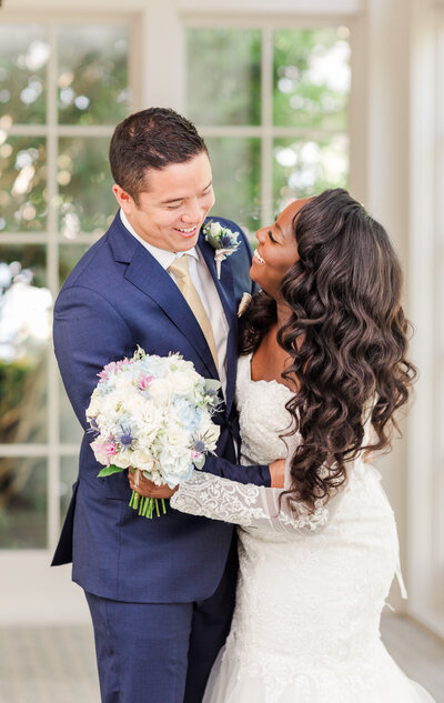 Mixed racial wedding couple at TPC Sugarloaf taken by  a Wedding Photographer in Atlanta