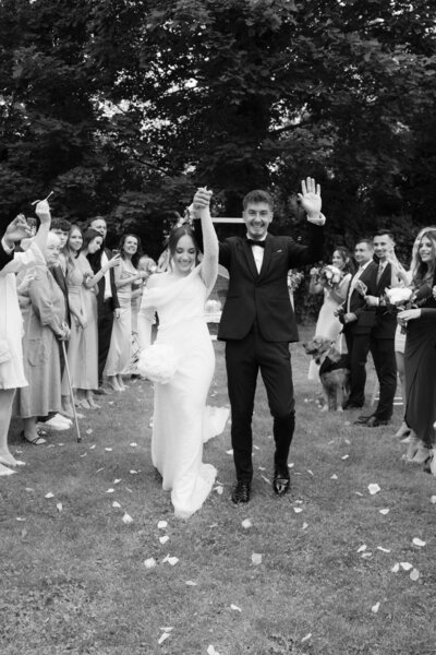 Luxury wedding in Europe – sophisticated bride in a modern wedding gown and groom in a timeless suit.