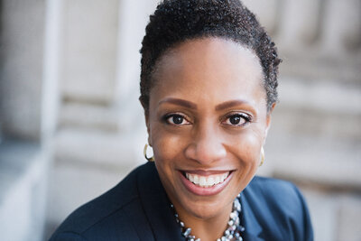 A headshot of a woman smiling.