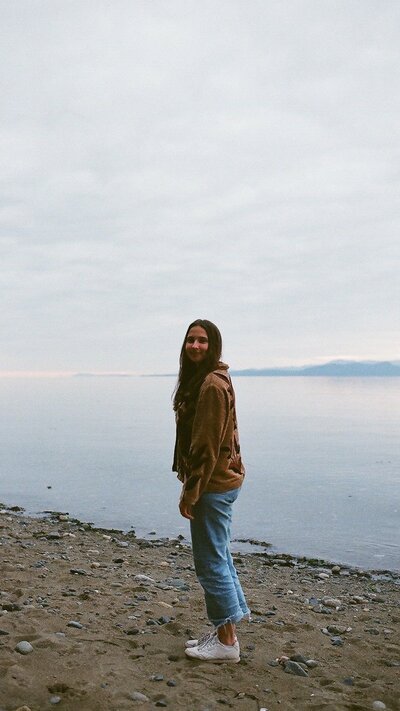 A photo of Hannah at the beach on Vancouver Island, surrounded by ocean views and coastal beauty.
