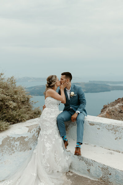 Groom placing the ring on his bride's finger at a small elopement in Michigan.