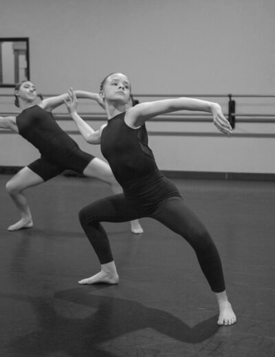 Dancers at ballet barre in Dallas studio
