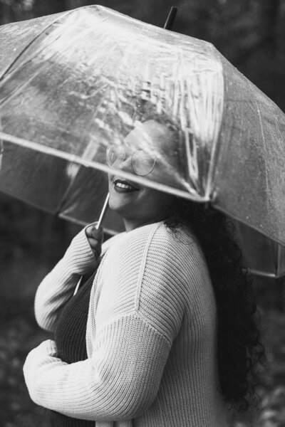 woman under clear umbrella