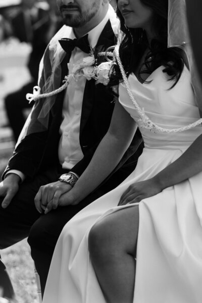 bride and groom holding hands during their Michigan Wedding Ceremony at Revival Wedding Barn