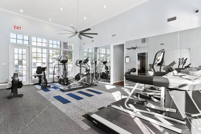 Fitness center at Hearthstone Apartments in McAllen Texas featuring modern equipment and clean resident amenities maintained by WLS Interests.