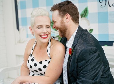 1950s pinup bride and rockabilly groom enjoying laughs in Nashville