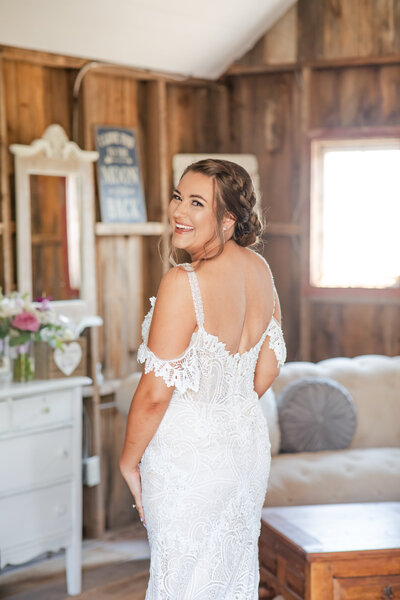 Kelsey in wedding dress with lace detail and view of the back.