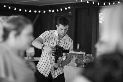 Isaac taking video during a wedding