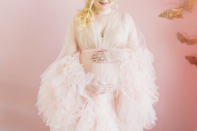 Maternity photo of a pregnant woman in a formal dress
