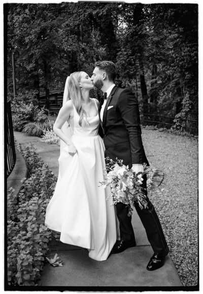wedding couple walking hand in  hand at their clementine nashville wedding
