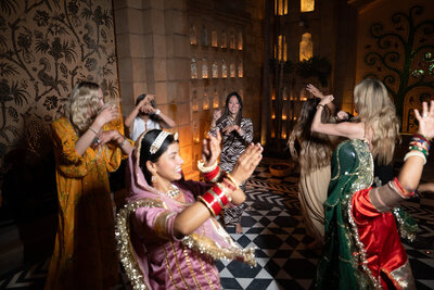 Women dancing in a circle in the evening in India
