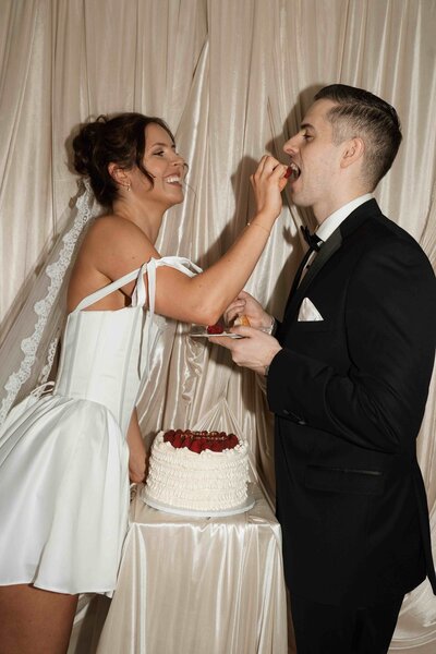 luxury wedding cake designer couple eating cake cambridgeshire