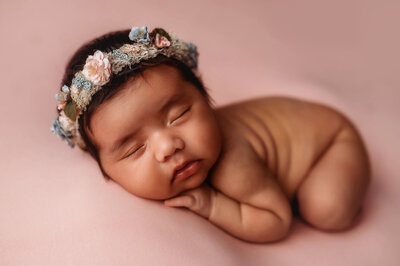 Infant posed for Newborn Portraits in Charleston, South Carolina Newborn Photography Studio.