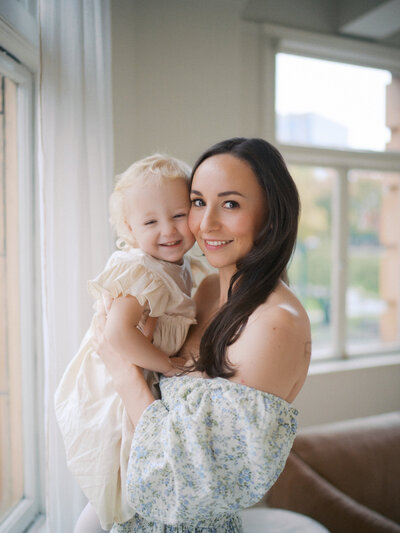 Portrait of mother and daughter during a family photoshoot inside a studio in Downtown Vancouver