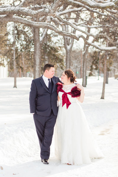 Bride and Groom sharing their first kiss during outdoor wedding