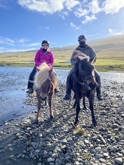 Logan Ferree and her husband horseback riding through Icelandic landscapes on their honeymoon.