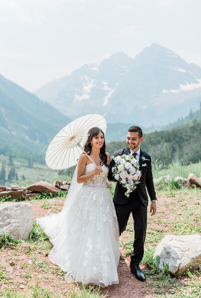bride and groom at maroon bells in aspen