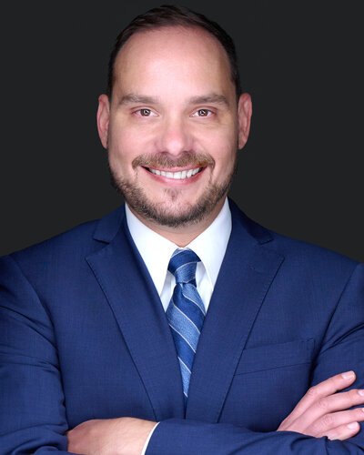 professional headshot with man smiling