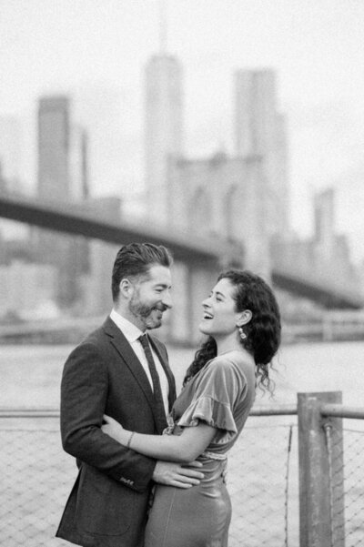 This engagement session, photographed along the iconic Brooklyn Bridge in New York City, captures a couple in a tender embrace with the Manhattan skyline as their backdrop. Felisha, a wedding photographer based in New England, specializes in creating authentic, heartfelt images in some of the most beautiful locations across the country, including the bustling heart of New York City.
