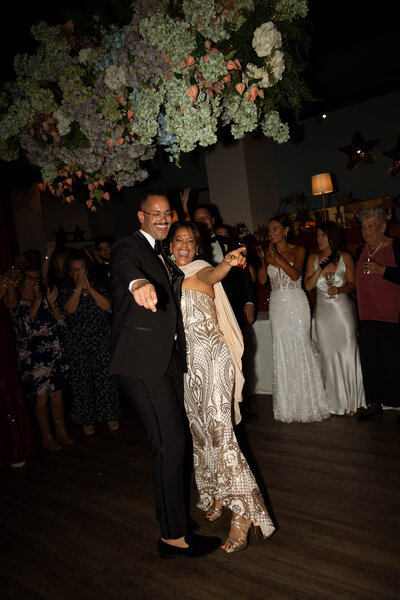 Mother Son bringing fun energy to their special dance