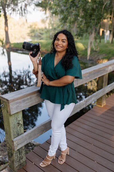 dani of indie west photo posing with camera