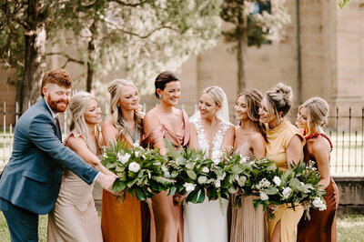 family smiling at camera