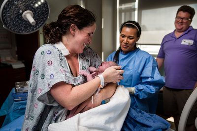 birth photography, mother holding baby, breastfeeding, hospital