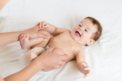 Canva - Doctor massaging infant baby
