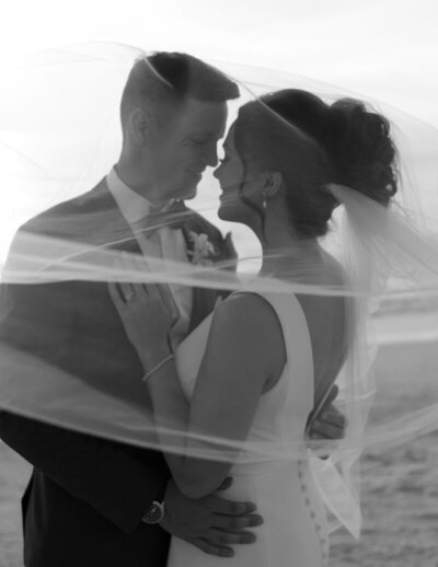 couple kissing on wedding day by marco island photographer