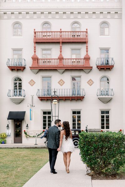 two wedding guests embrace at the night before wedding