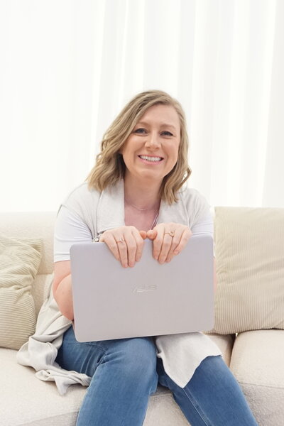 Female operations, systems and workflows consultant with a laptop