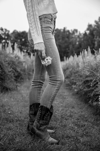 Black & White photo of girl holding a flower | Senior Session Photography