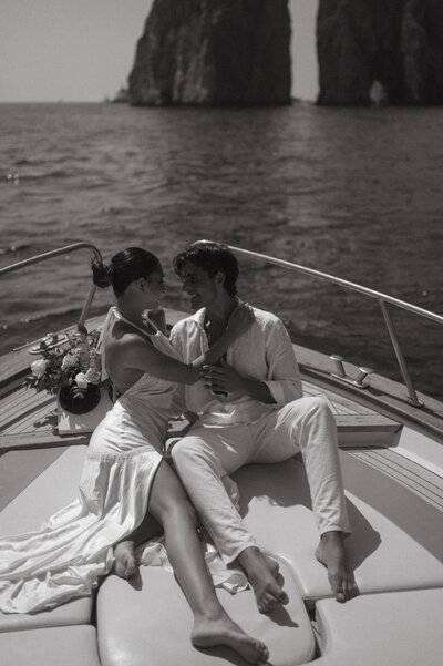 Couples sitting in a yacht for their engagement session