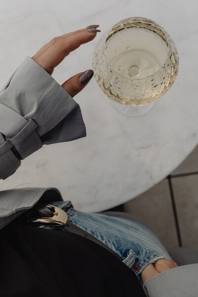 woman holding wine glass