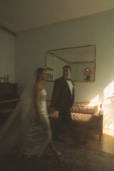 Vintage-inspired bride posing in lush Hawaiian gardens at Haiku Mill, captured on 35mm film