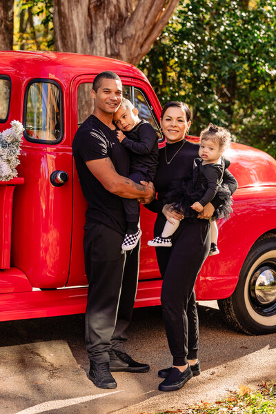 family with red truck