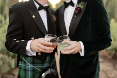 large mirror styled with two floral pieces at a wedding