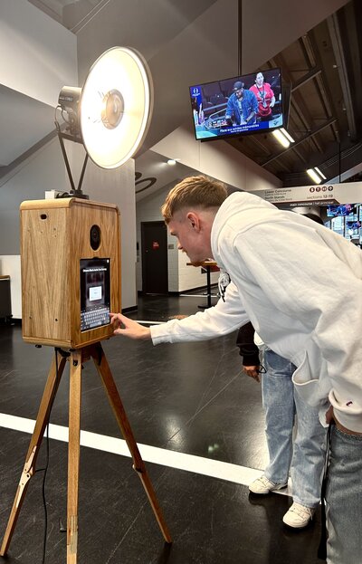 Branded photo booth collecting emails and survey response at Ottawa BlackJacks game at TD Place