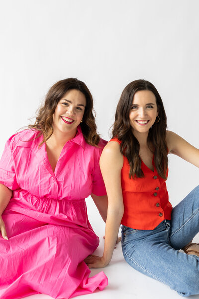Female entrepreneurs Brittany Heyboer and Niki DeConcini promoting their Twin Cities founders group