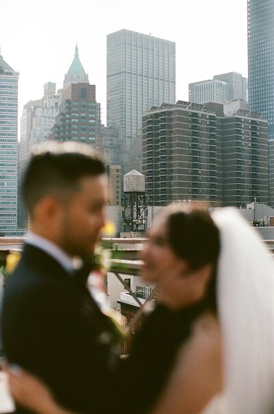 couple celebrate engagement with a champagne pop