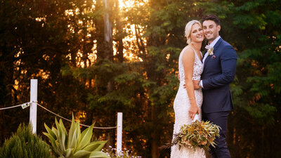 cinematic wedding films on the coast with a bride and groom hugging