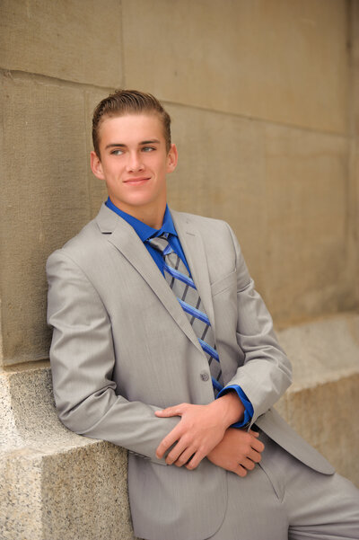 High school senior boy looking to the side during photography session with Boise portrait photography Tiffany Hix