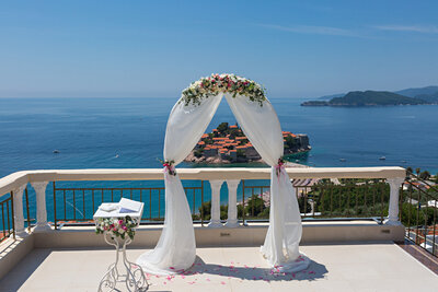 Outdoor wedding ceremony site with beach view