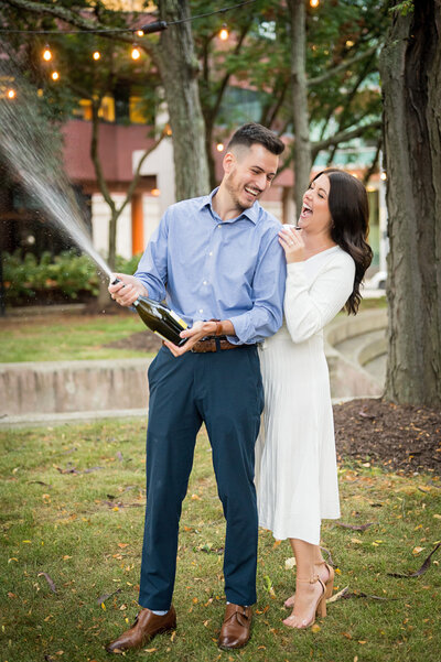 engaged couple celebrating with champagne picture north shore pittsburgh