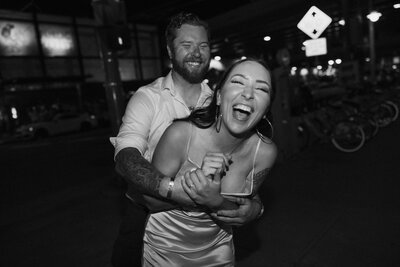 bride and groom holding hands